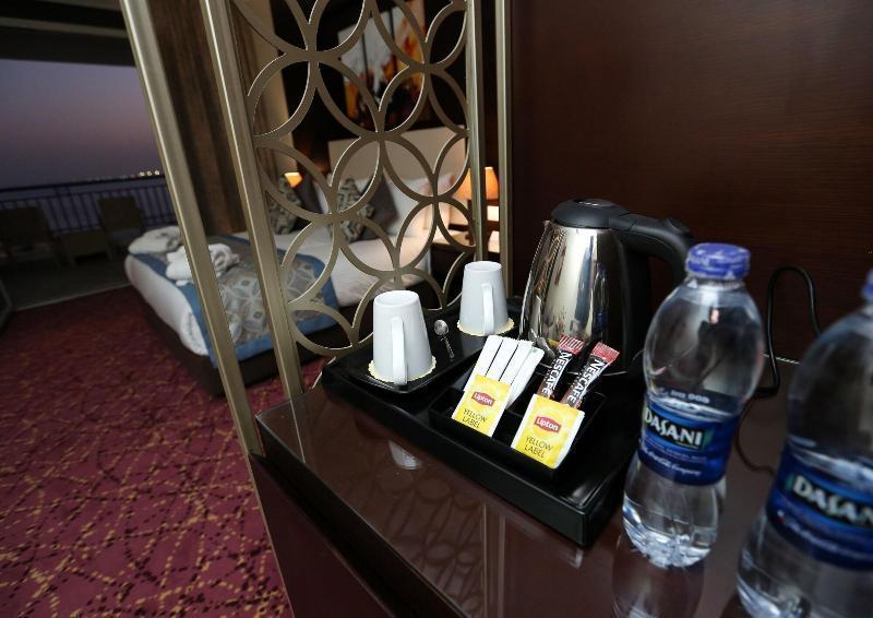 Tolip El Forsan Hotel Iszmáilija Kültér fotó Bottled water in a hotel room