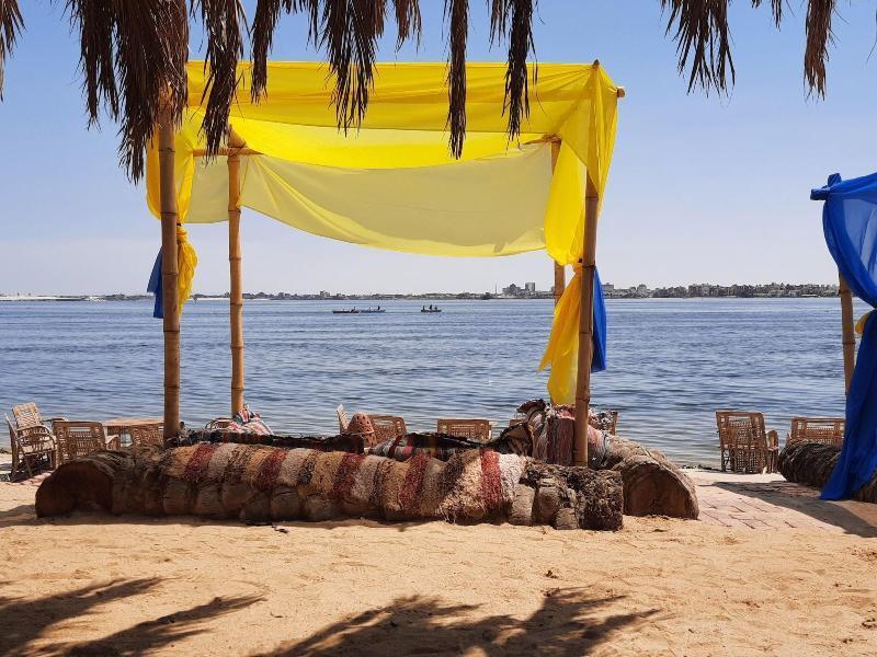 Tolip El Forsan Hotel Iszmáilija Kültér fotó A sukkah on the beach of the Sea of Galilee