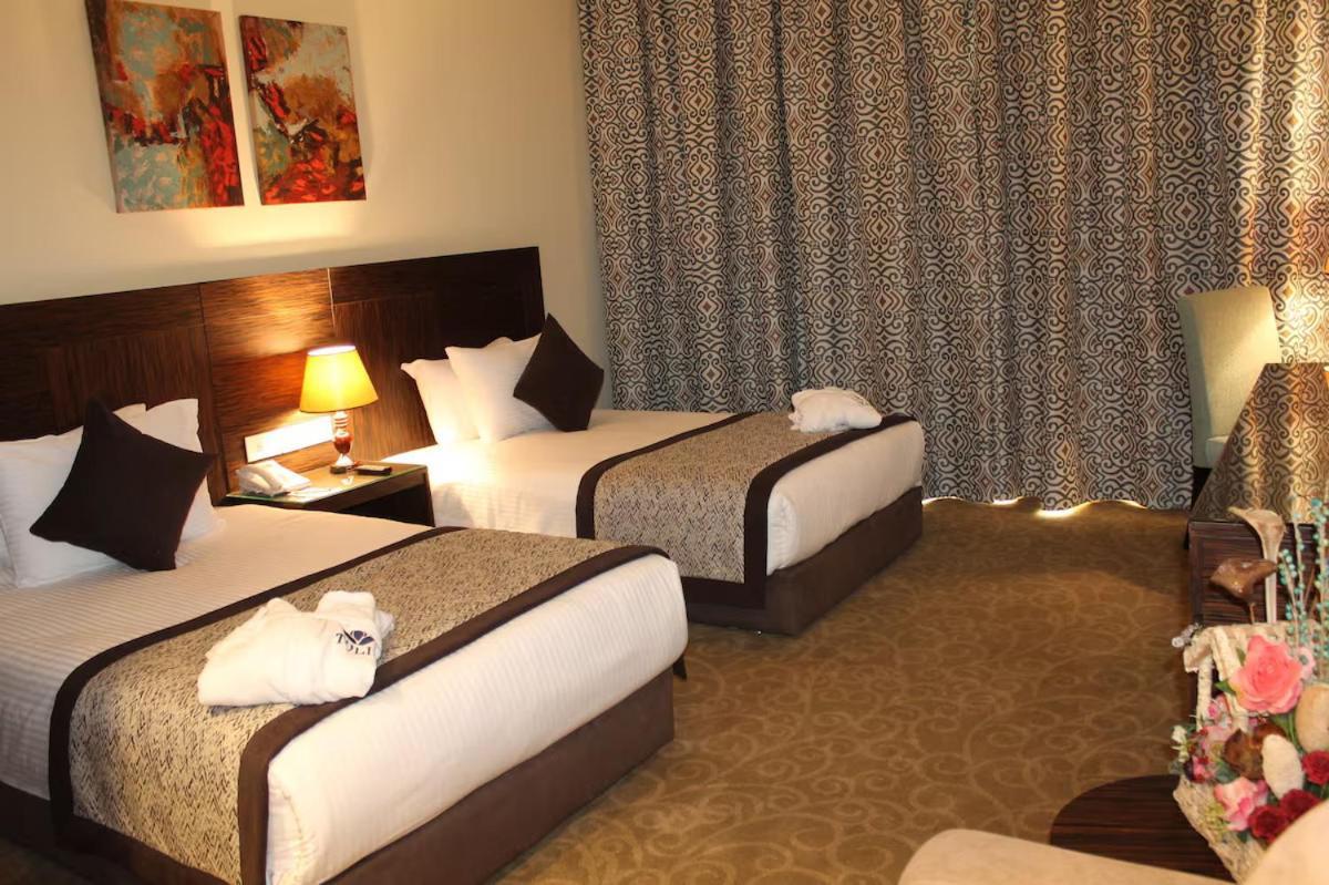 Tolip El Forsan Hotel Iszmáilija Kültér fotó A room at the hotel